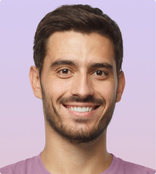 Happy smiling man on a purple background